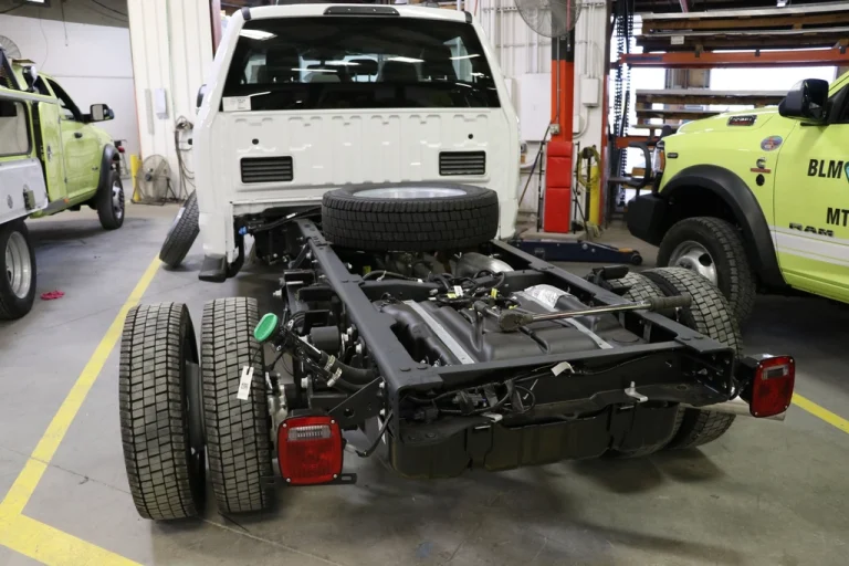 Car raised on a workshop lift for a pre-MOT inspection